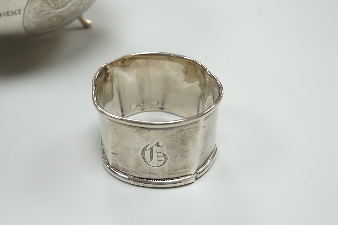 A late Victorian repousse silver navette shaped dish, by Charles Edwards, London, 1894, 25.7cm, with engraved monogram and date, together with a pair of mid 18th century silver sugar nips, an early 19th century silver vi